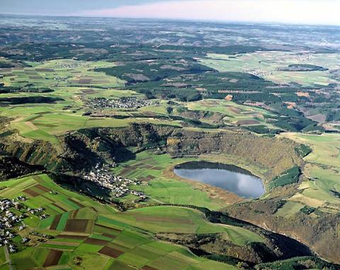 aerial photo of the lake with surrounding clliffs